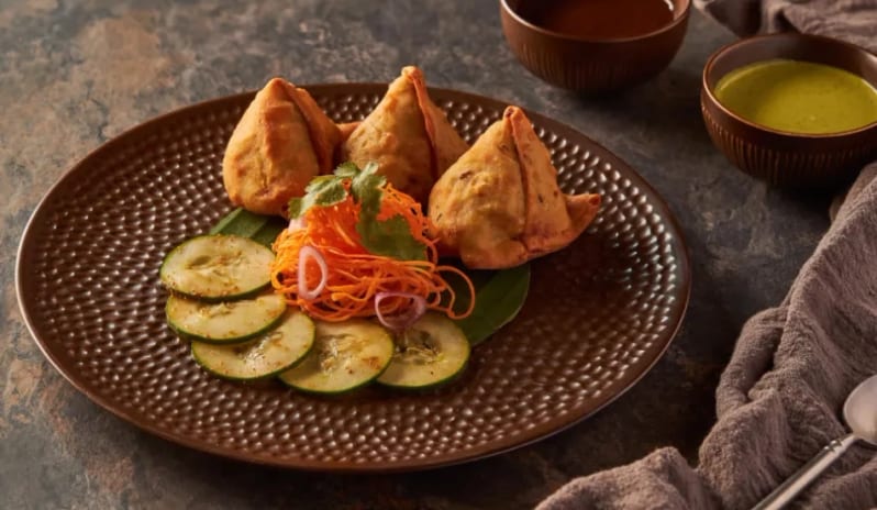 Agra Crispy Indian samosas served with cucumber salad, mint chutney, and tamarind dip at Moon Palace The Grand Punta Cana by Kenwood Travel