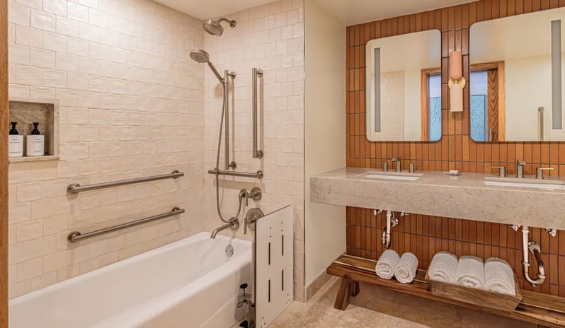 Deluxe Ocean View Queen Beds, Balcony bathroom with bathtub safety grab bars and double vanityat Salterra, A Luxury Collection Resort & Spa, South Caicos by Kenwood Travel