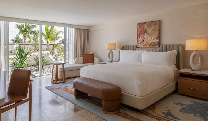 Deluxe Ocean View King Bed, Balcony Luxury ground-floor guest bedroom with king bed and floor-to-ceiling garden view at Salterra, A Luxury Collection Resort & Spa, South Caicos by Kenwood Travel
