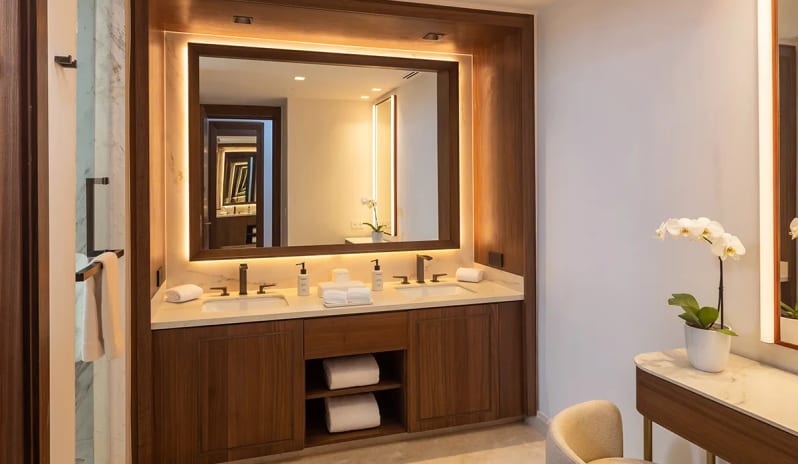 Grand Presidential Suite Ocean View bathroom with illuminated double vanity and makeup table at Moon Palace The Grand Punta Cana by Kenwood Travel