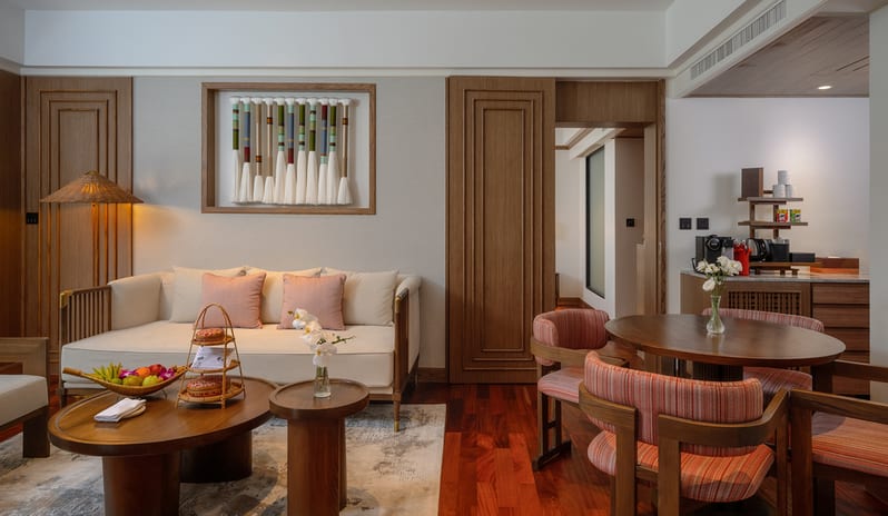 Club Two Bedroom Family Suite Lounge seating area and round dining table at Anantara Hua Hin Resort  by Kenwood Travel