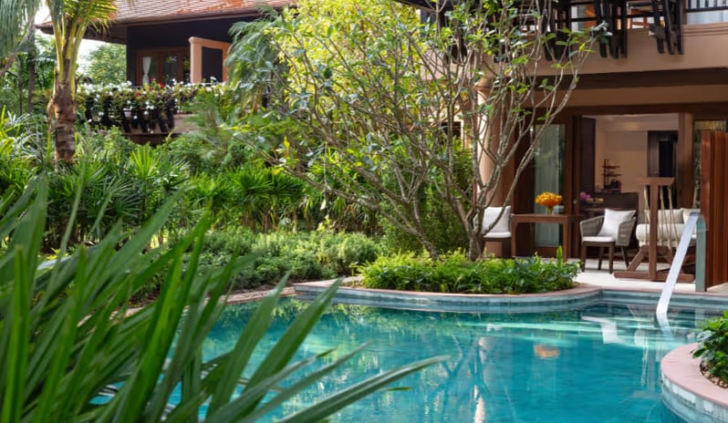 Deluxe Pool Access terrace overlooking a tropical swimming pool at Anantara Hua Hin Resort  by Kenwood Travel