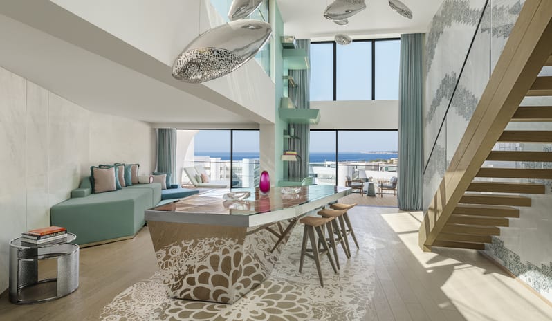 Penthouse II Suite, One Bedroom Suite with Pool Modern duplex penthouse living room with high ceilings, island bar, and ocean views at W Algarve by Kenwood Travel