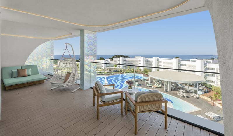 Penthouse II Suite, One Bedroom Suite with Pool Covered luxury suite terrace with hanging egg chair and panoramic pool and sea view at W Algarve by Kenwood Travel
