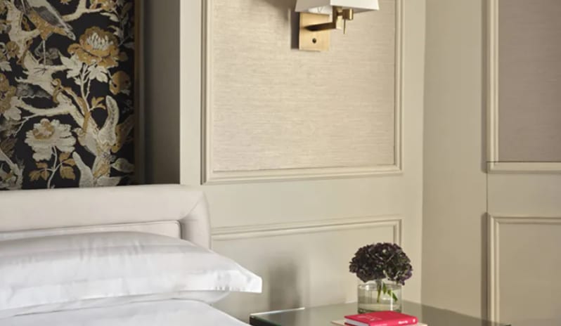 Corner Junior Suite Bedside nightstand and breakfast tray service at Palazzo Venezia by Kenwood Travel
