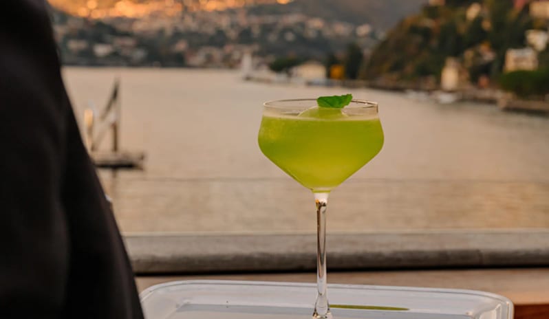 Altariva Restaurant Green cocktail on a silver tray served on the lakeside terrace at Palazzo Venezia by Kenwood Travel
