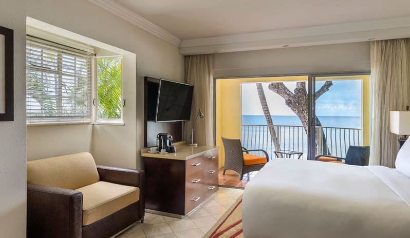 Ocean View Room Beachfront hotel bedroom featuring a ocean view balcony  - Tamarind Hotel by Kenwood Travel