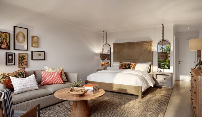 Junior Suite Hotel guest room with a king bed, living area, and natural woven decor - Tamarind Hotel by Kenwood Travel