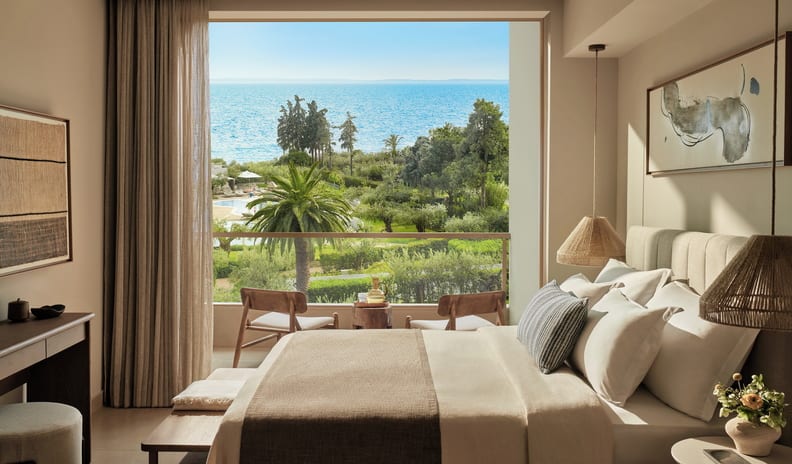 Superior Double Pool View Oceanfront hotel room featuring a king bed and private balcony Ikos Olivia by Kenwood Travel
